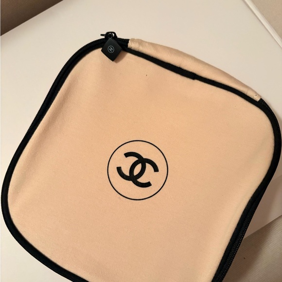 CHANEL Handbags - CHANEL Cream and Black Pouch